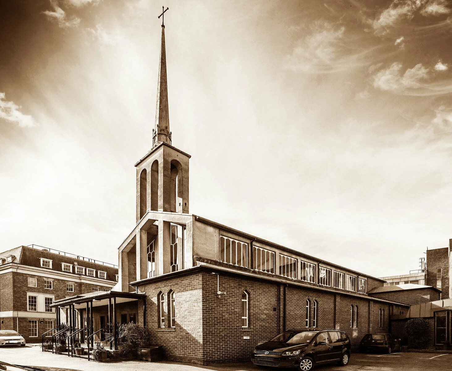 Church with steeple and shining light behind